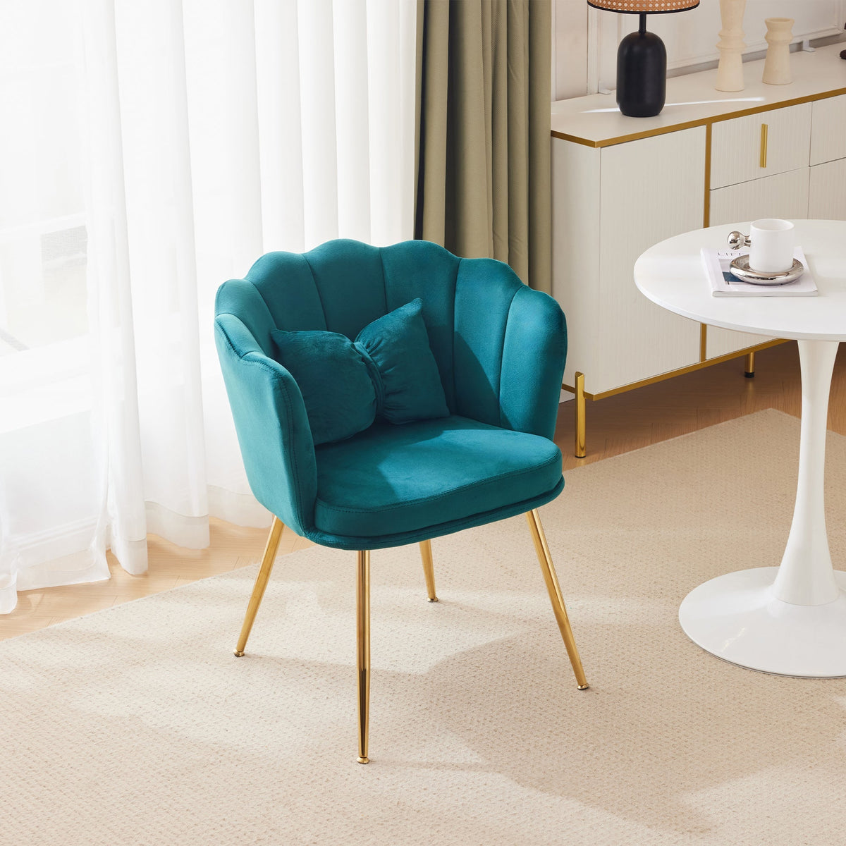 Modern velvet armchair, comfortable upholstered with petal back, gold-plated metal legs and butterfly cushion