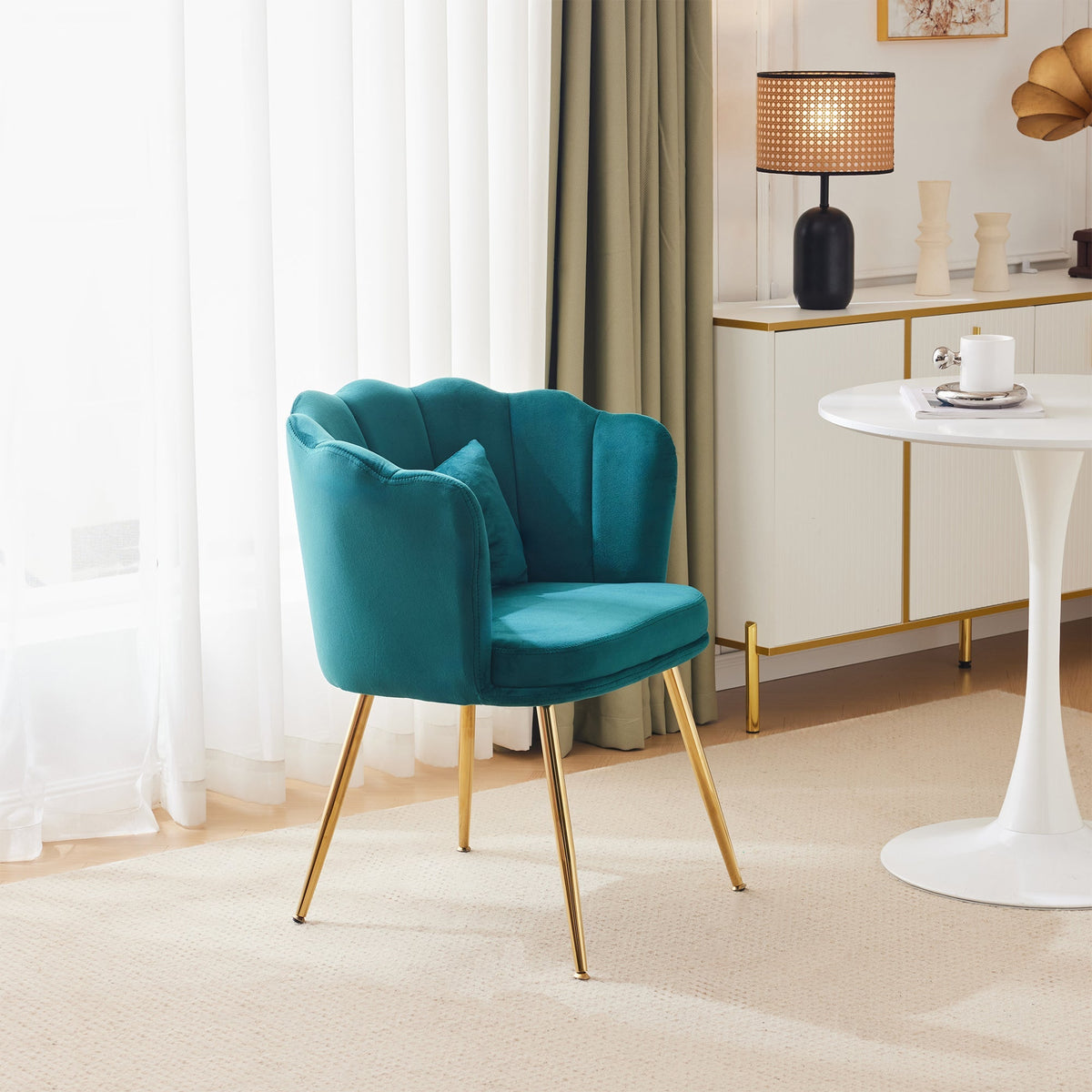Modern velvet armchair, comfortable upholstered with petal back, gold-plated metal legs and butterfly cushion