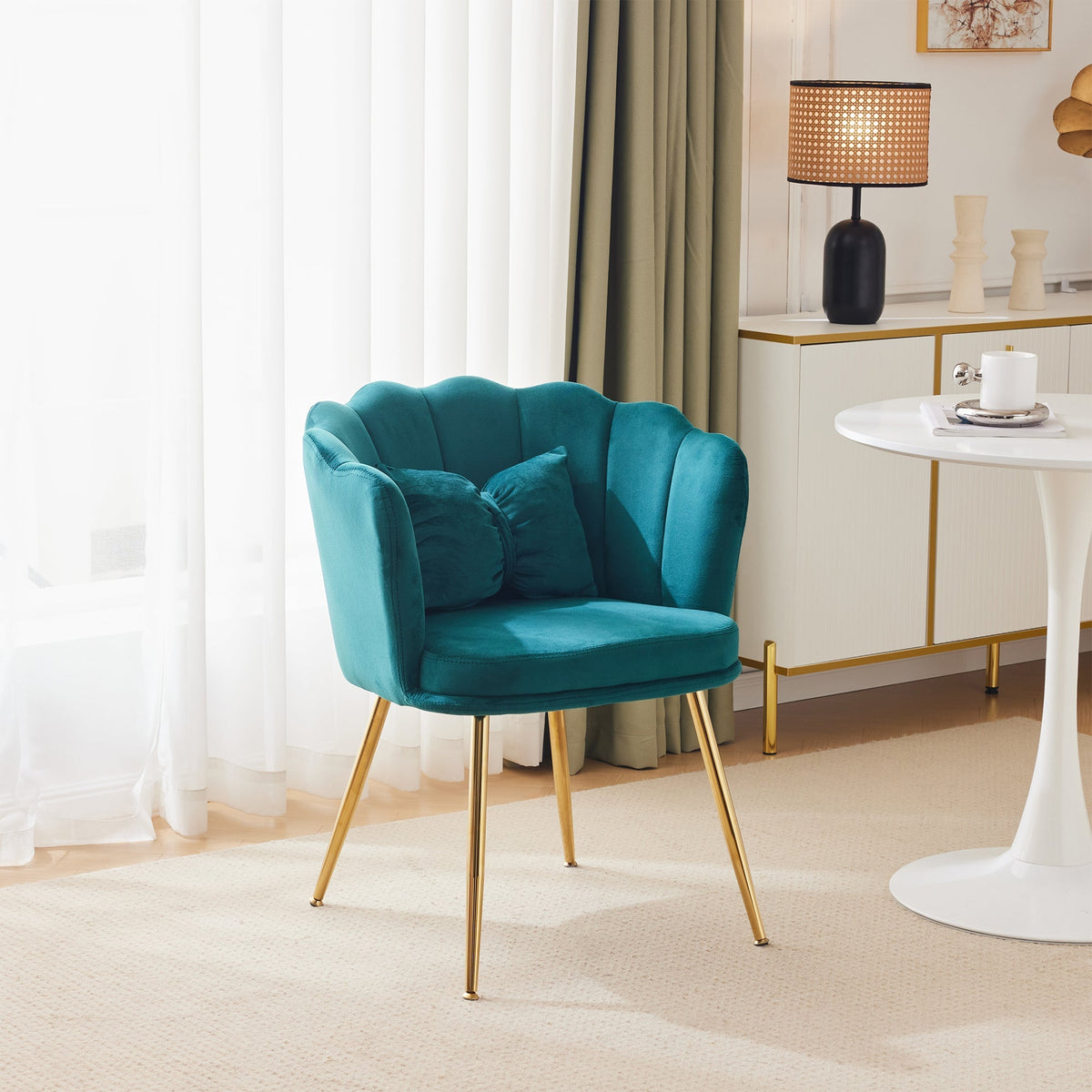 Modern velvet armchair, comfortable upholstered with petal back, gold-plated metal legs and butterfly cushion